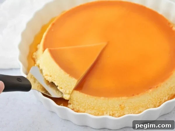 Homemade flan recipe being sliced out of dish.