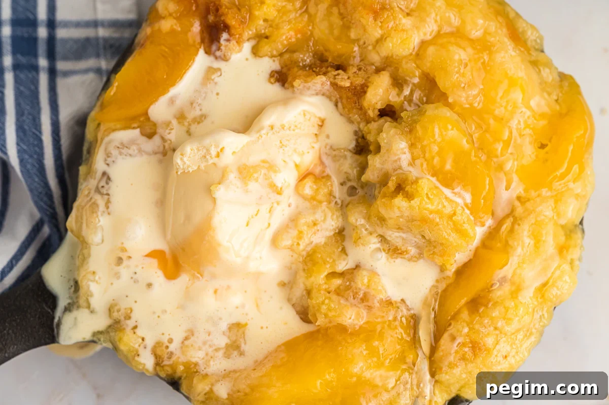 overhead shot of peach cobbler partly eaten.