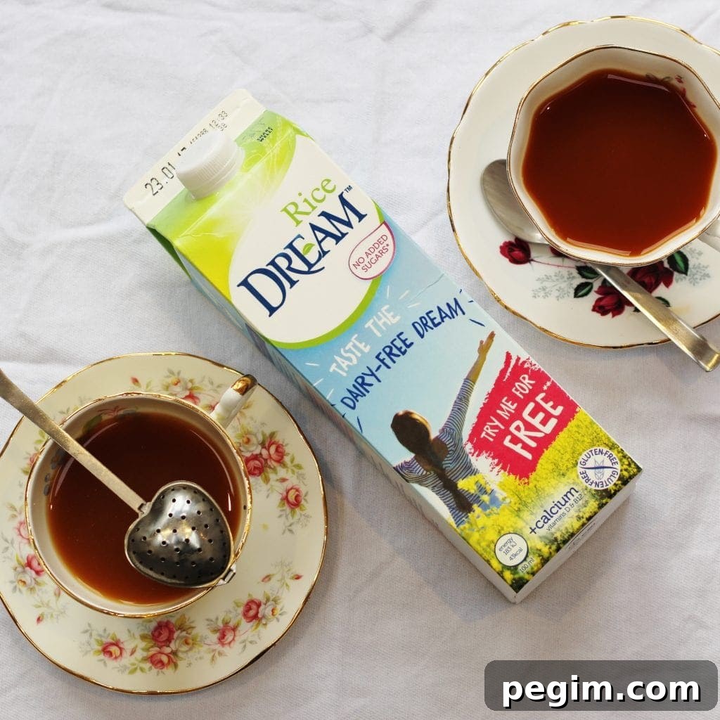Carton of Rice Dream with two cups of tea