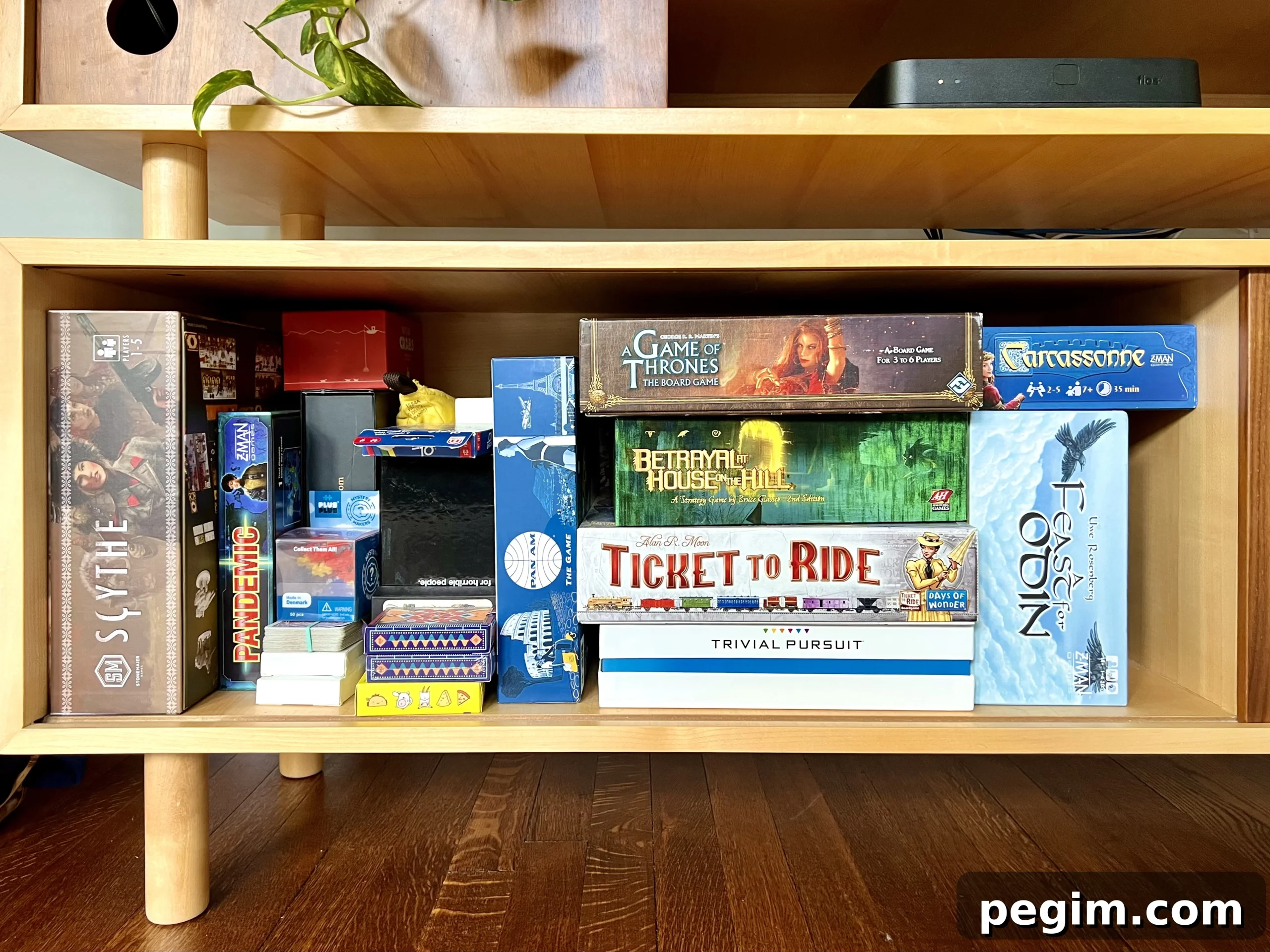 6 Ways to Embrace Hygge This Autumn 4 Board games in a cabinet.