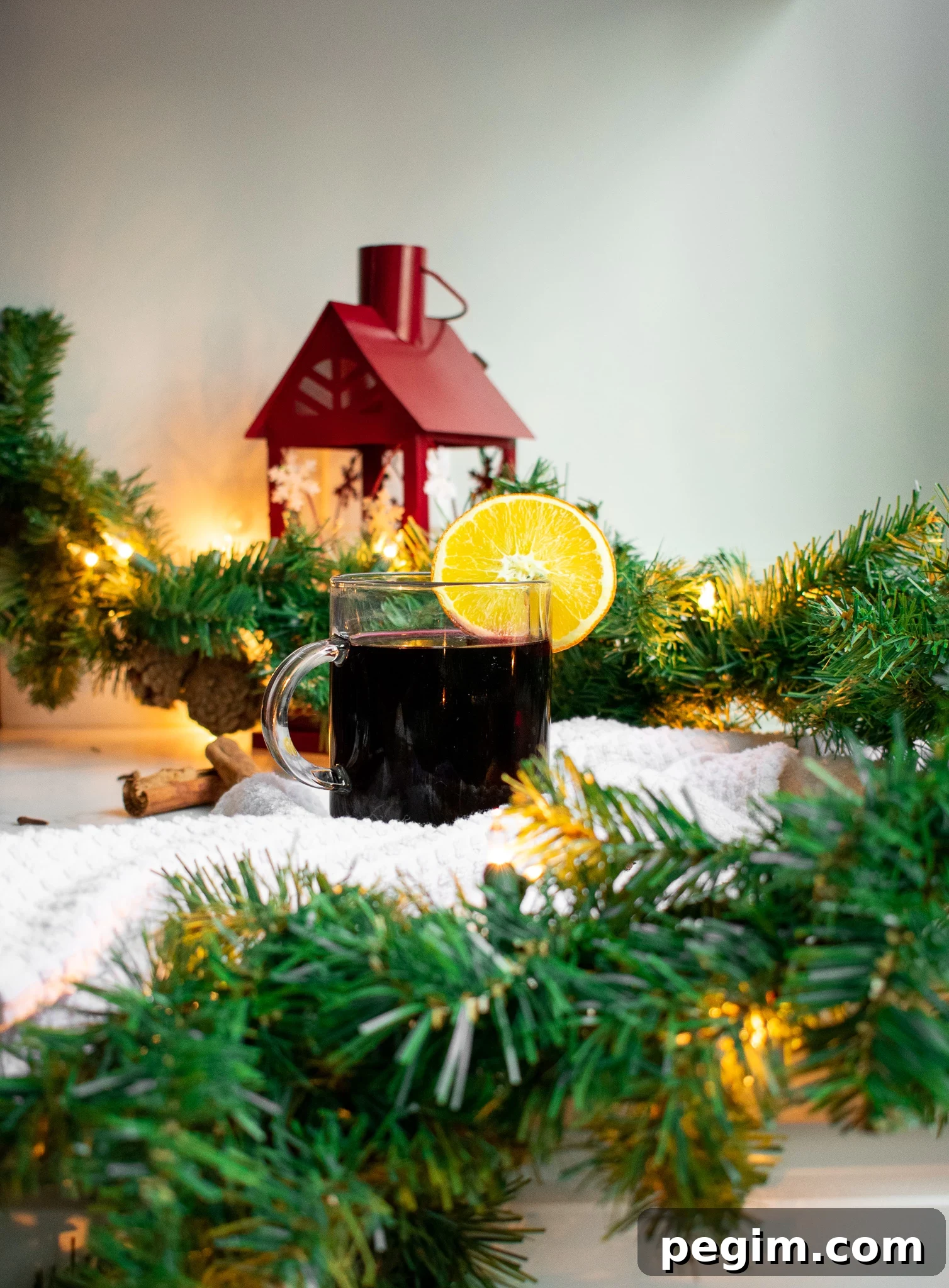 6 Ways to Embrace Hygge This Autumn 6 Danish mulled wine in a glass with an orange slice and spices surrounding the glass.