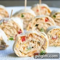 This easy Mexican Pinwheels Recipe is a party favorite that's full of bright, bold flavors you'll crave!