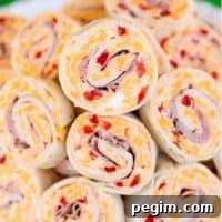 Ham & Pimento Cheese Pinwheels piled on a plate