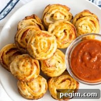 Sure to please the pickiest of eaters, this Pizza Muffin Recipe is a quick & easy mom win! And they can be made to order with your favorite pizza toppings!