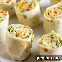 Vegetable Tortilla Roll Ups lined up on a platter