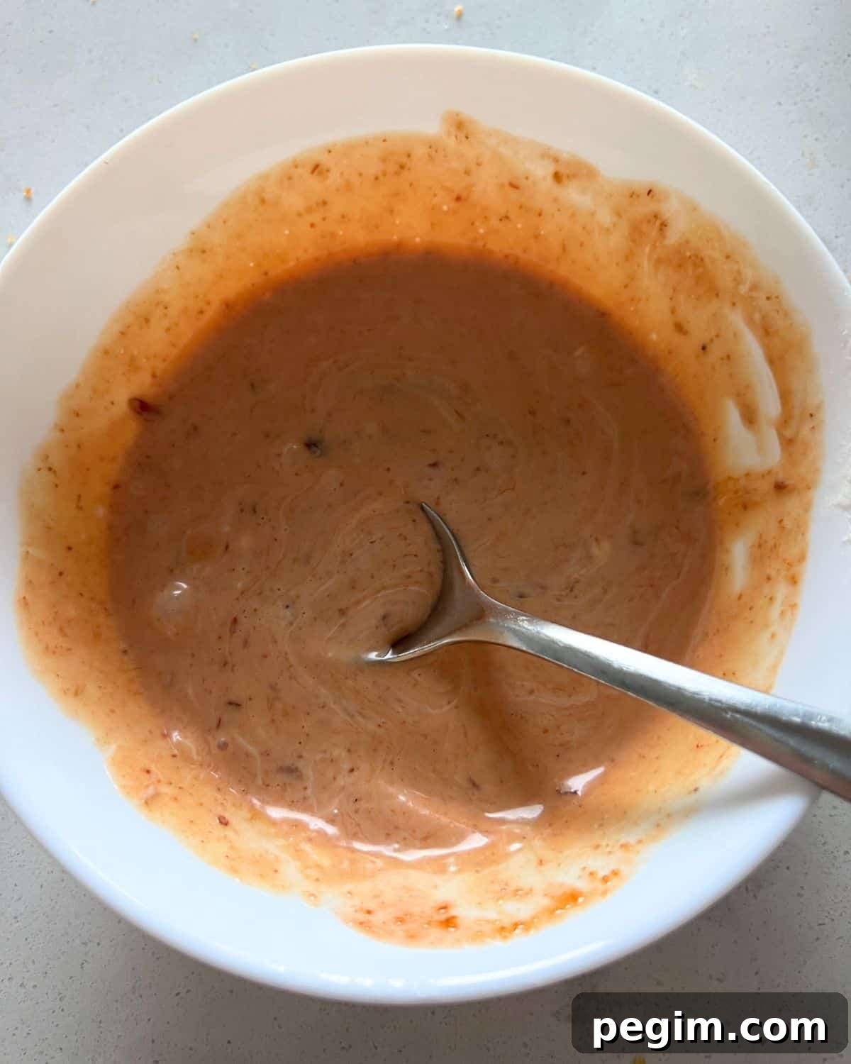 Bang bang sauce mixed together in a bowl.