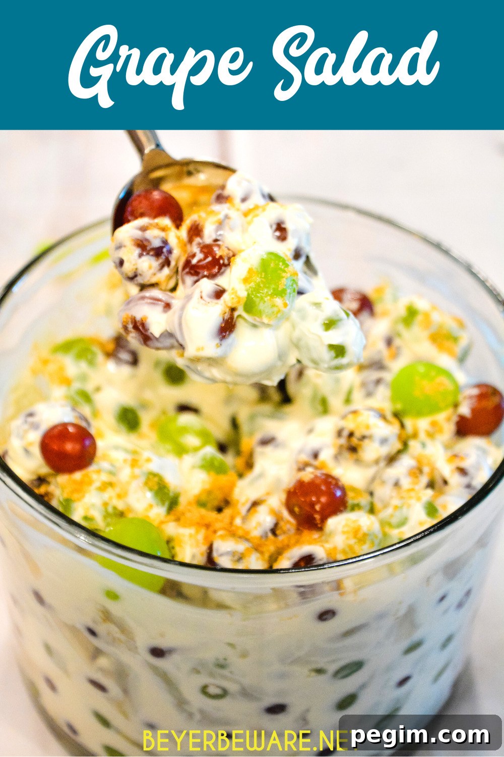 Creamy grape salad made with red and green grapes, cream cheese, sour cream, and brown sugar.