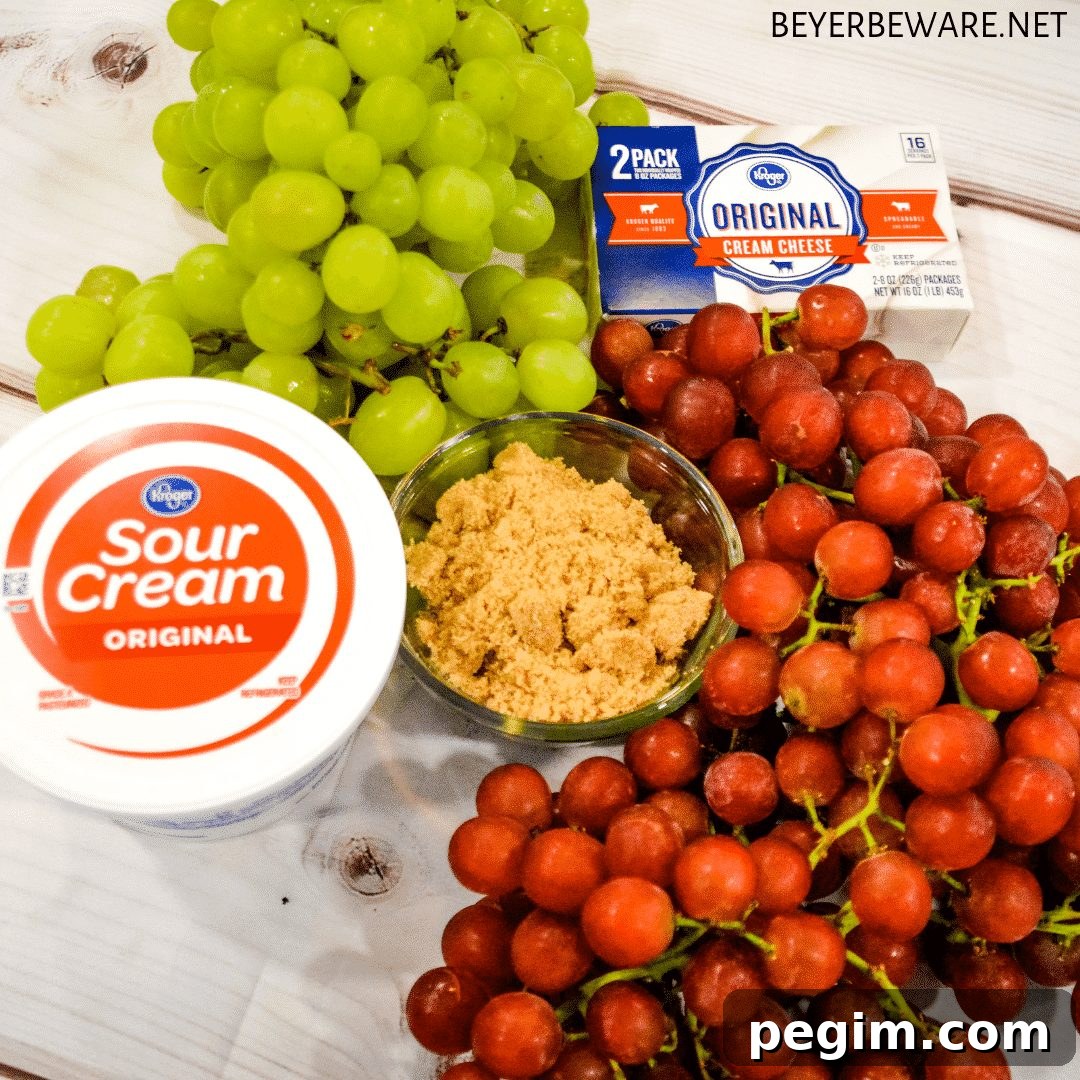 Ingredients for creamy grape salad: grapes, cream cheese, sour cream, and brown sugar.