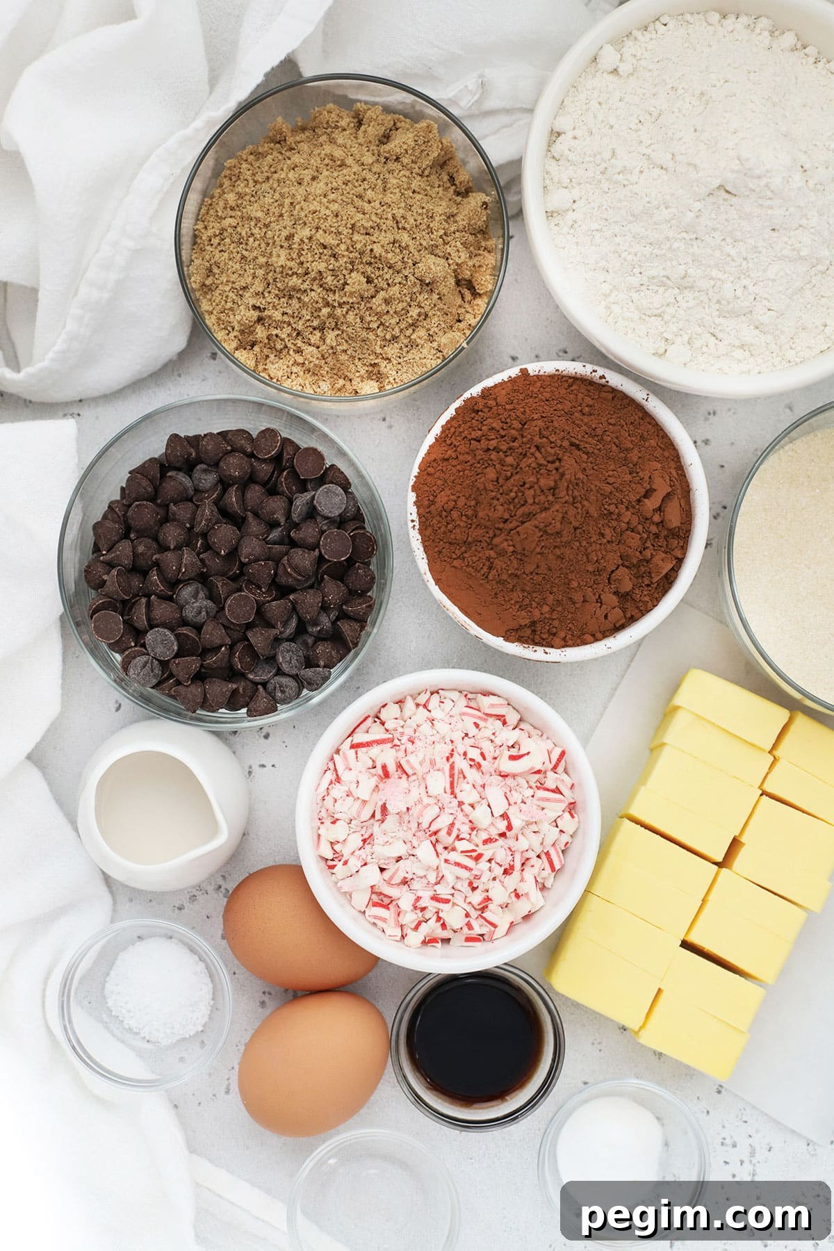 Ingredients for gluten-free chocolate peppermint cookies in small bowls