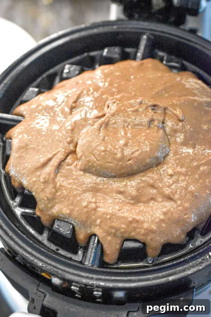 The batter is added to the waffle iron.