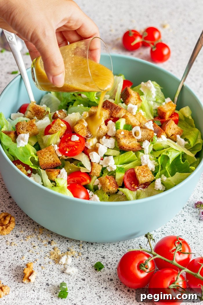 Pouring Walnut Dressing over Goat Cheese Salad