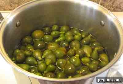 Boil figs in syrup for greek fig spoon sweet, sikalaki gliko.