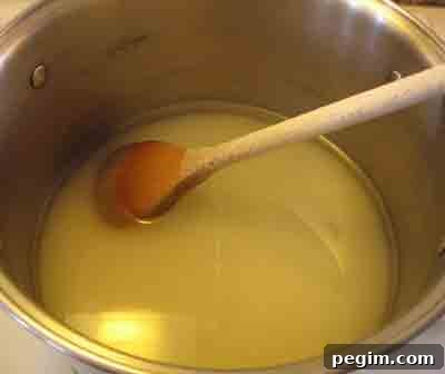Boiling syrup to thicken it for the greek recipe sikalaki gliko, fig spoon sweet.