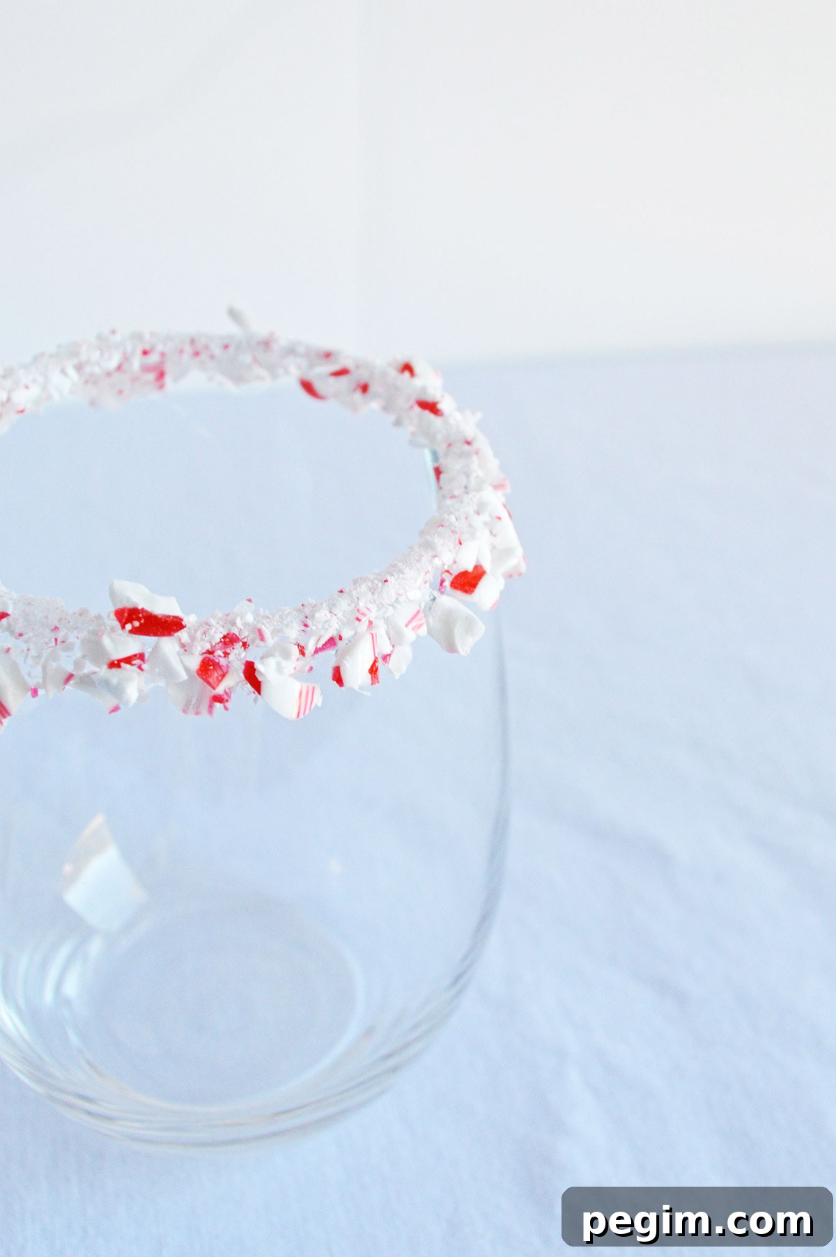 Peppermint White Russian Cocktail Recipe for the Holidays 3 glass with a crushed candy cane rim