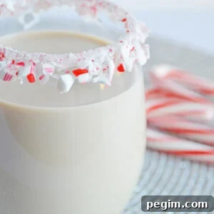 Peppermint White Russian Cocktail Recipe for the Holidays 5 peppermint white Russian in a glass with a candy cane rim
