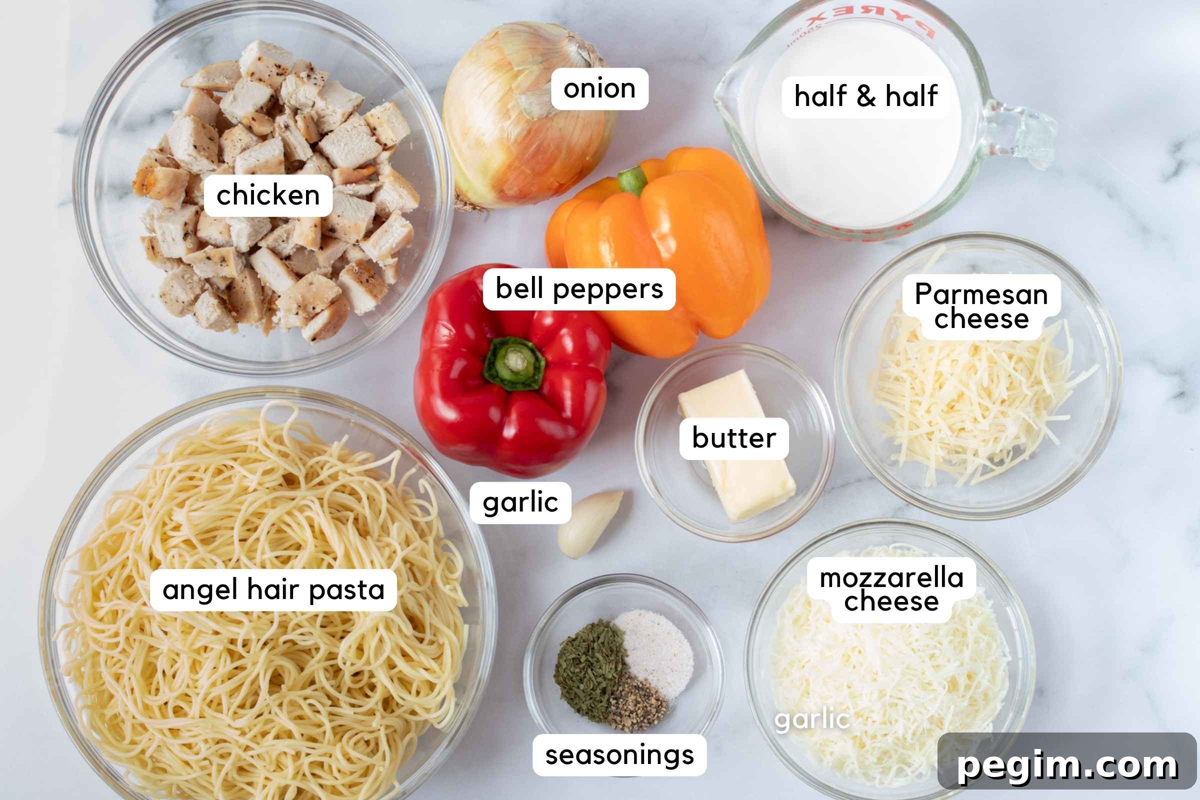 Ingredients: cooked chicken, onion, red bell pepper, yellow bell pepper, half and half, butter, garlic, shredded Parmesan cheese. shredded mozzarella cheese, cooked angel hair pasta, and small bowl with tarragon, pepper, and salt.