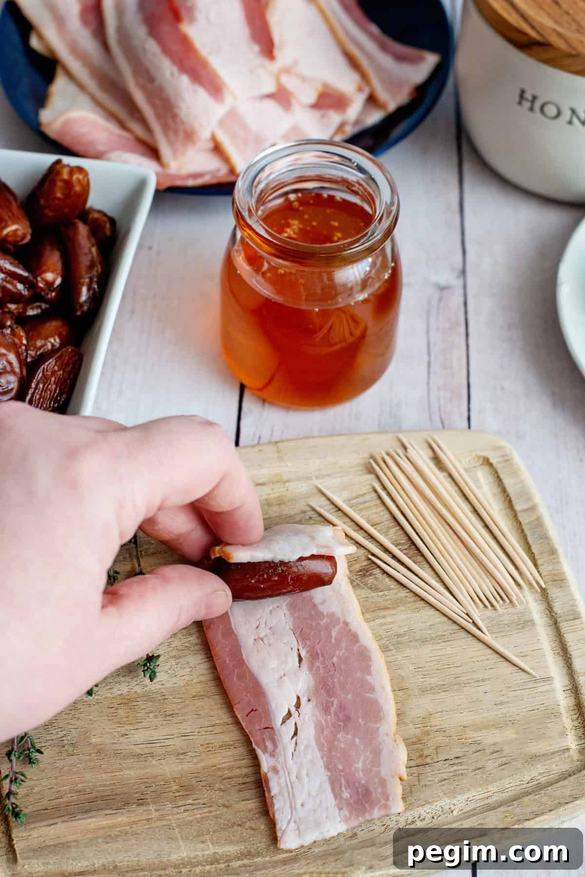 Wrap date with 1/2 slice of bacon