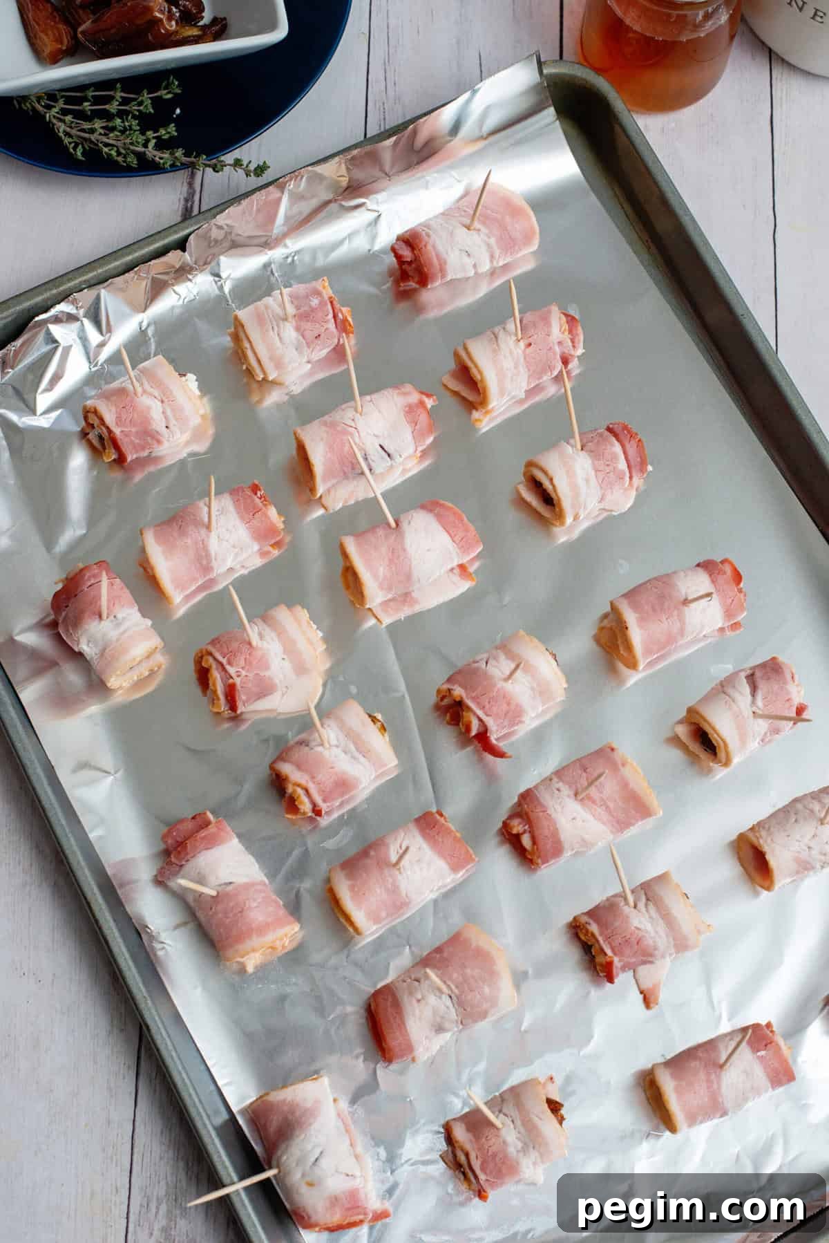 place Bacon Wrapped Dates on prepared baking sheet