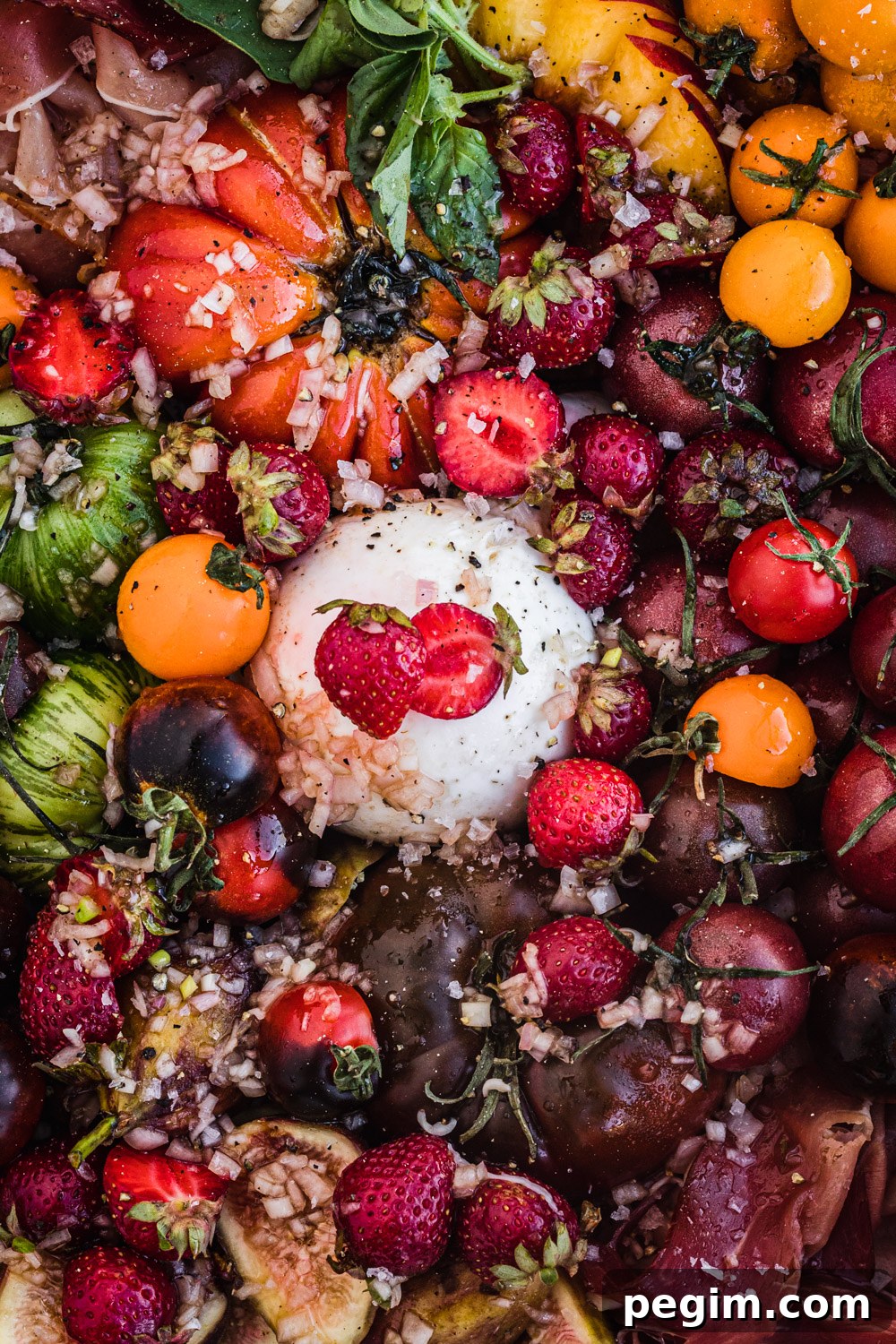 Summer salad with tomatoes, peaches, figs, prosciutto and burrata.