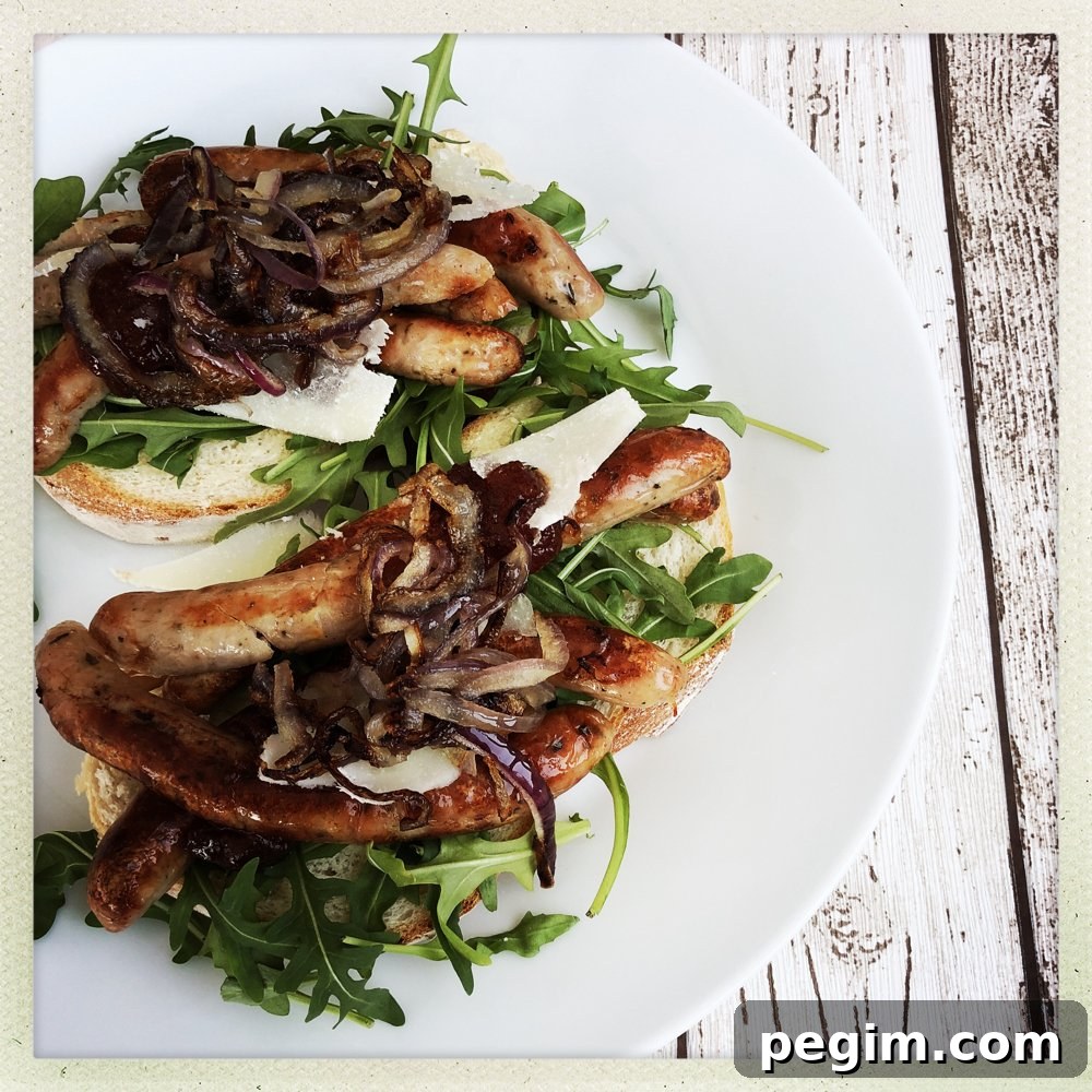 fresh white bloomer bread topped with rocket, chipolatas, parmesan shavings, tomato chilli jam and crispy fried onions.
