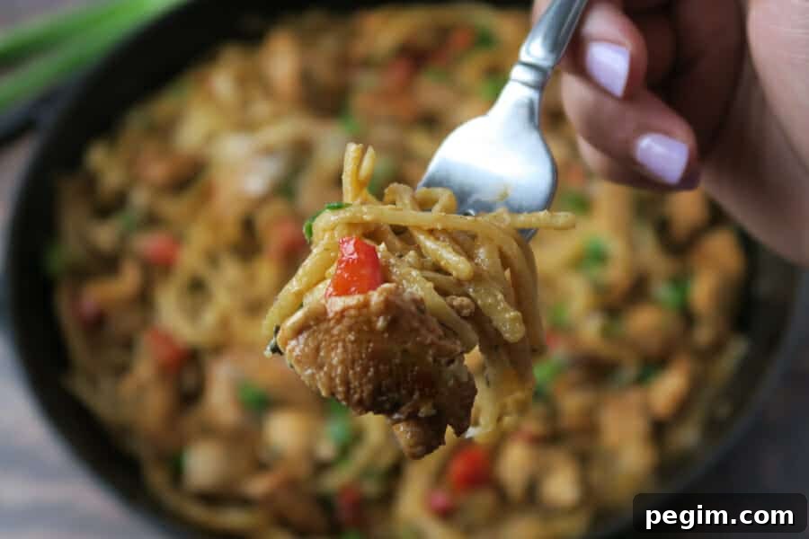 bite shot of the one pot creamy cajun chicken pasta