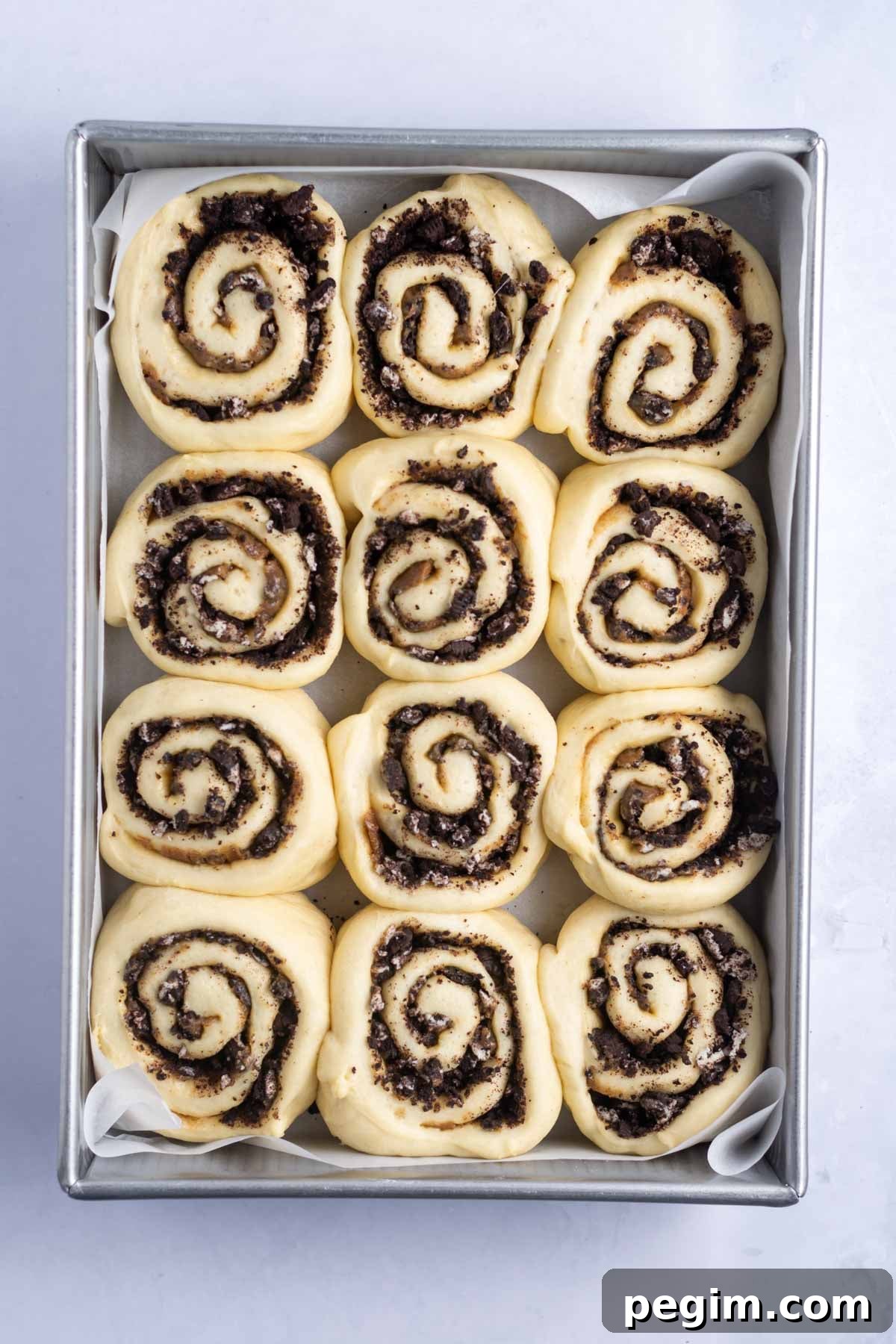 oreo cinnamon rolls after the second rise in a baking pan