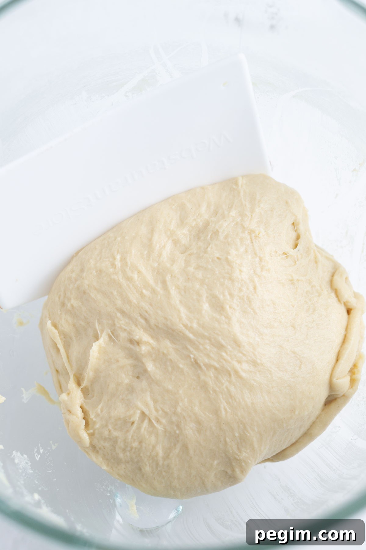 The cinnamon roll dough after it has been mixed in the mixer.