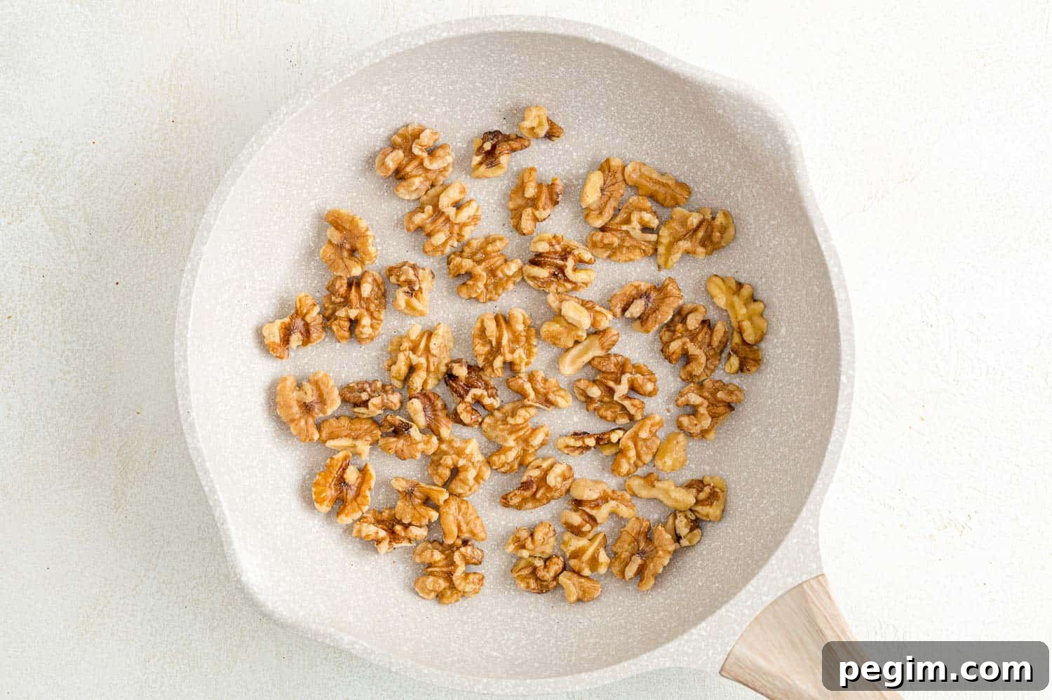Walnuts in a frying pan.
