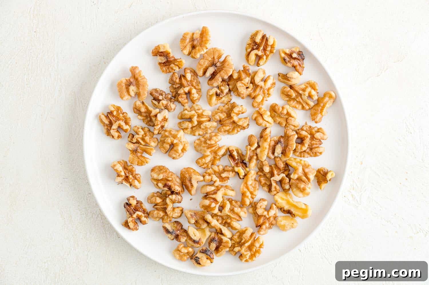 Walnut halves on a plate.