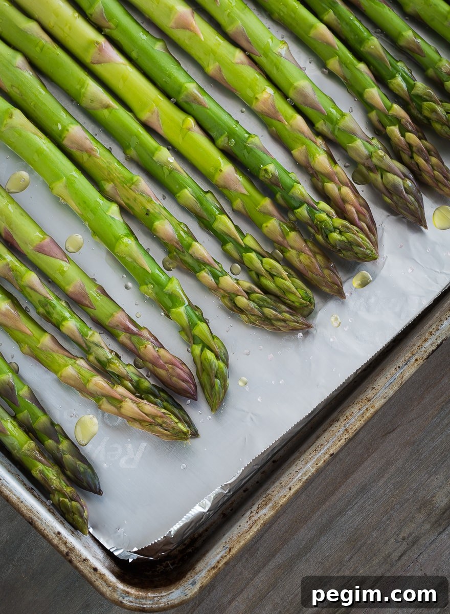 Asparagus on a roasting pan.