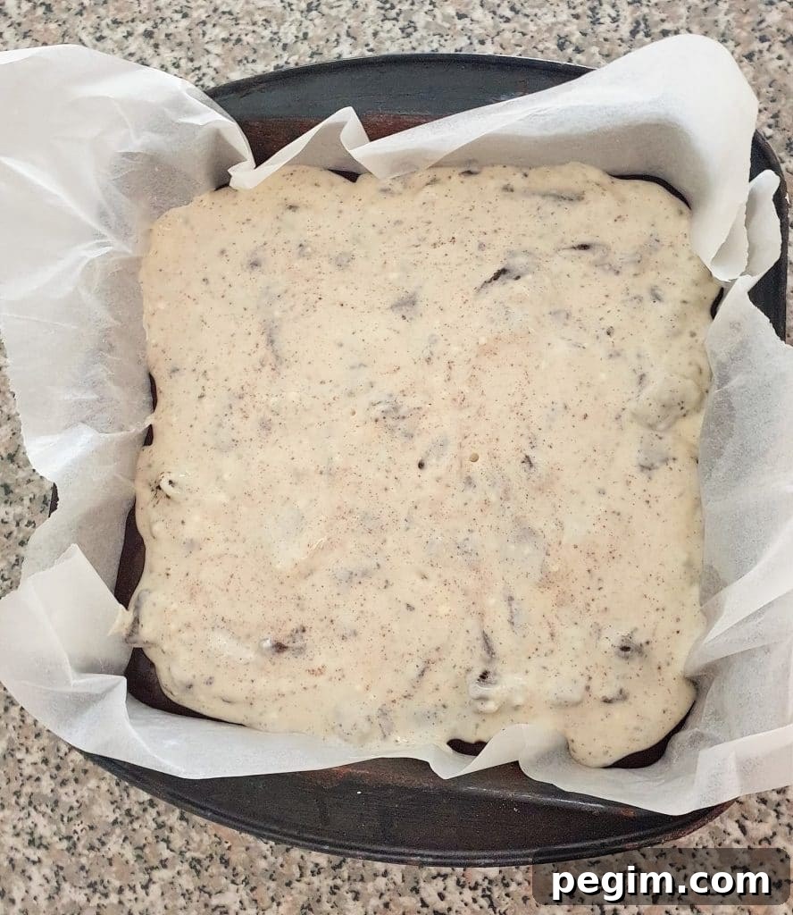 Cookies and Cream Cheesecake Brownies Recipe 14 Oreo cheesecake in a baking pan.