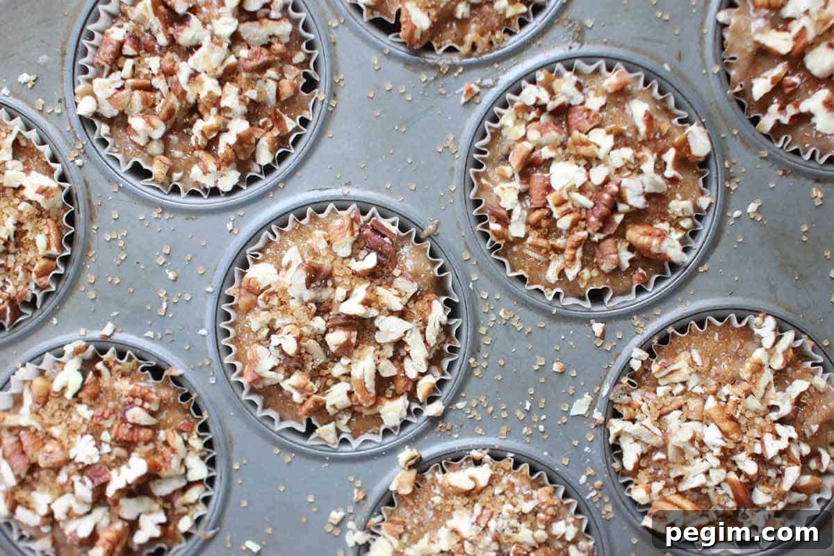 Whole Wheat Banana Nut Muffins Recipe 4 a muffin pan with banana nut muffin batter in it