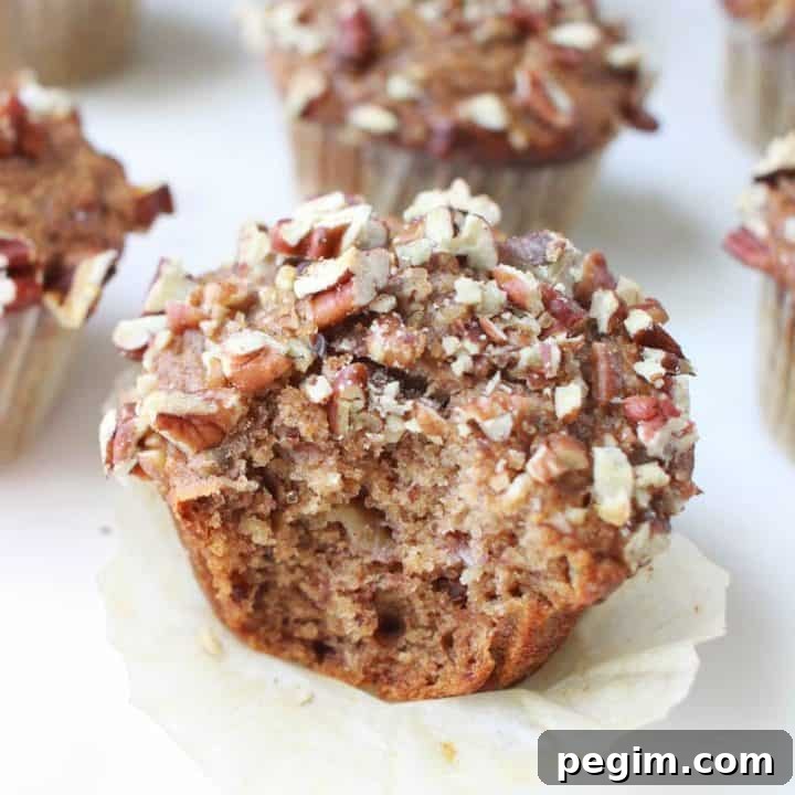 banana nut muffins on a white marble cutting board