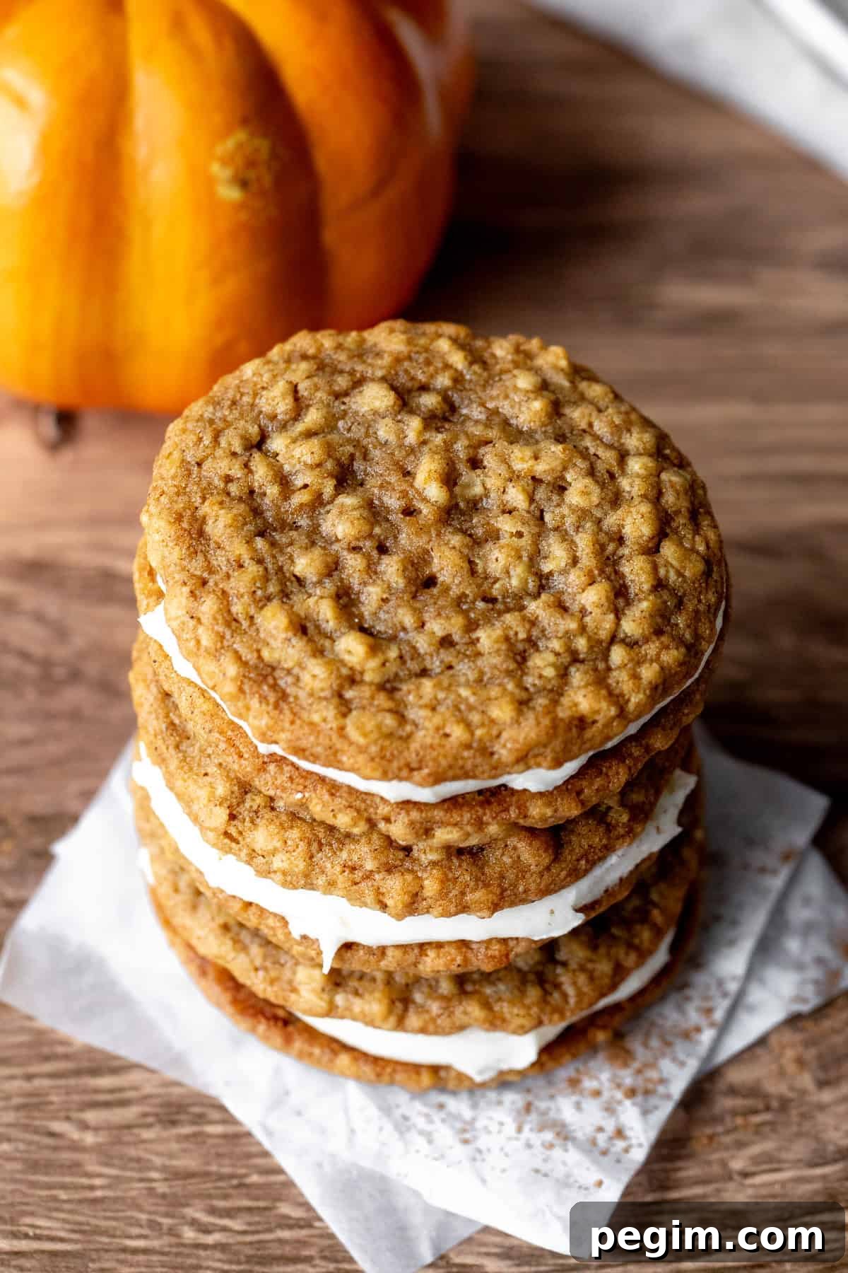 Homemade Pumpkin Oatmeal Cream Pies Recipe 3 Stack of three pumpkin cookies sandwiched together with cream cheese frosting