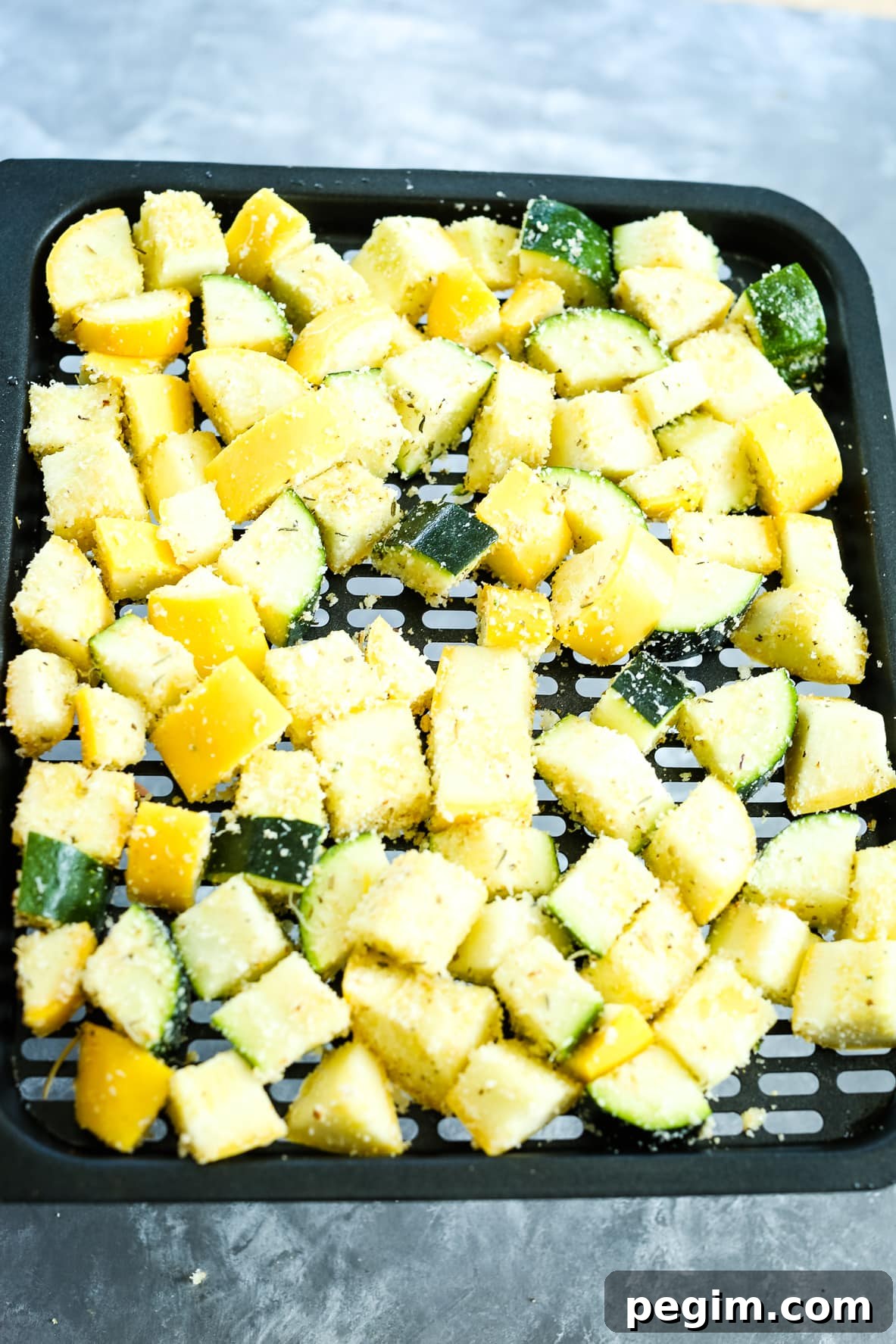 Crispy Air Fryer Zucchini and Yellow Squash in 15 Minutes 7 zucchini and squash on a tray for air fryer