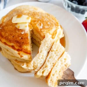 Fluffy Greek Yogurt Pancakes That Stay Light and Tender 15 A bite of fluffy Greek yogurt pancakes on a fork.