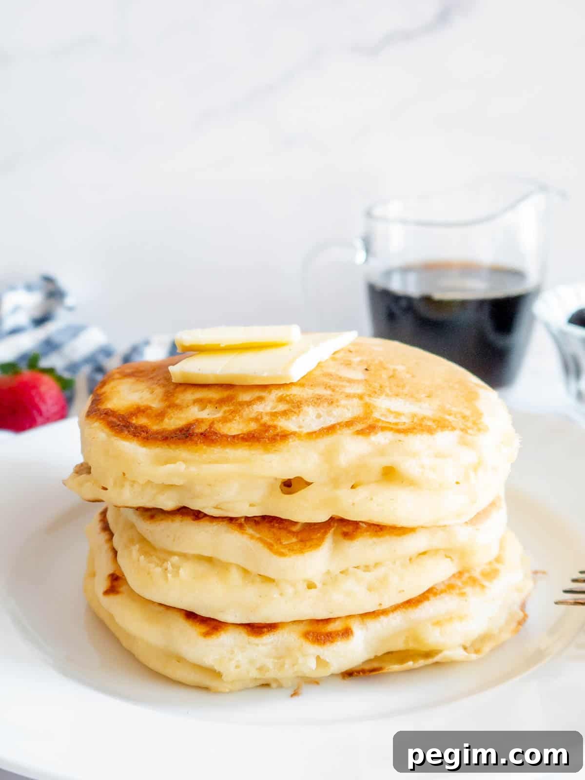 Fluffy Greek Yogurt Pancakes That Stay Light and Tender 9 Greek yogurt protein pancakes stacked on top of each other.
