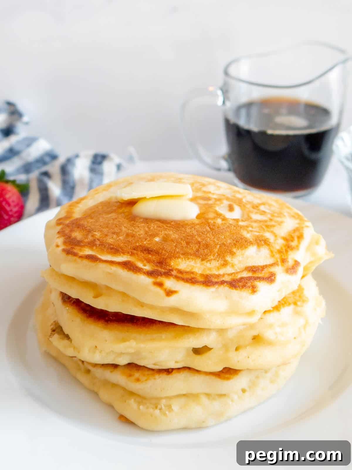 Fluffy Greek Yogurt Pancakes That Stay Light and Tender 10 High protein pancakes stacked on top of each other.