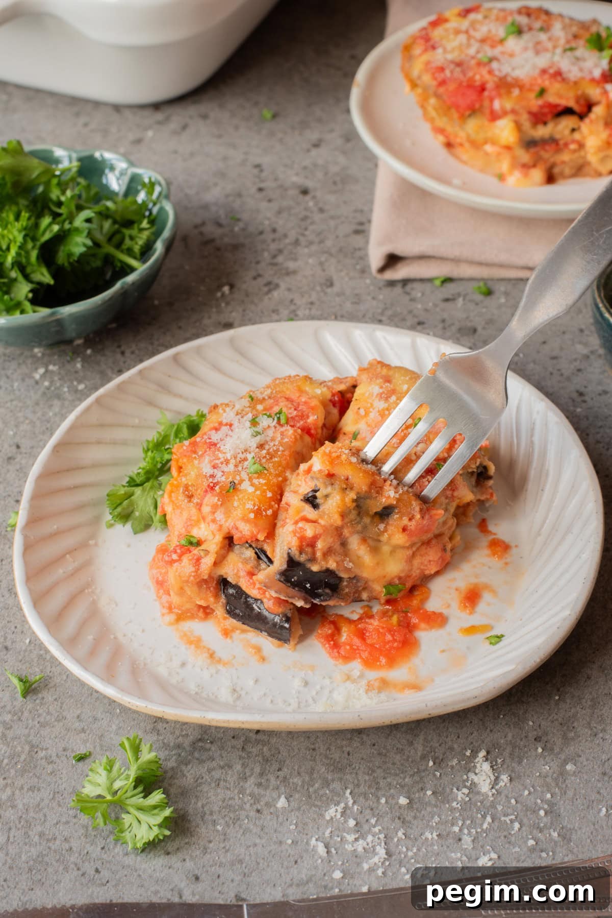 Crispy Baked Eggplant Parmesan Recipe 2 A close up image of a serving of eggplant parmesan on a plate.