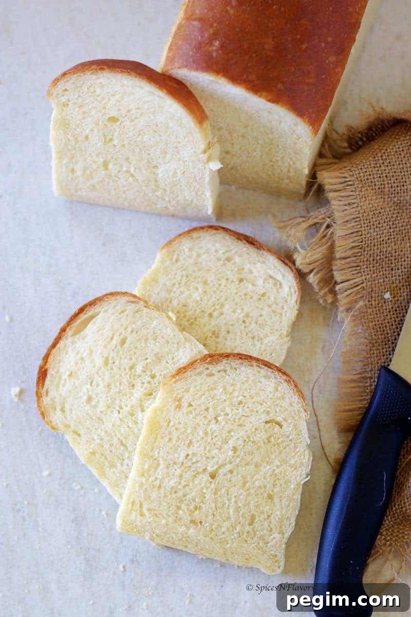 Bake Homemade White Bread in 5 Simple Steps 11 bread slices placed adjacent to each other on a white board