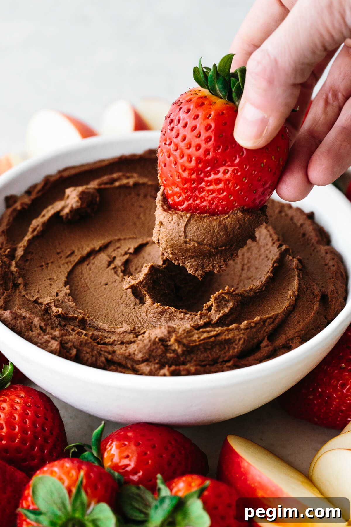 45+ Delicious Vitamix Recipes for Every Meal 4 Dipping a strawberry into chocolate hummus.