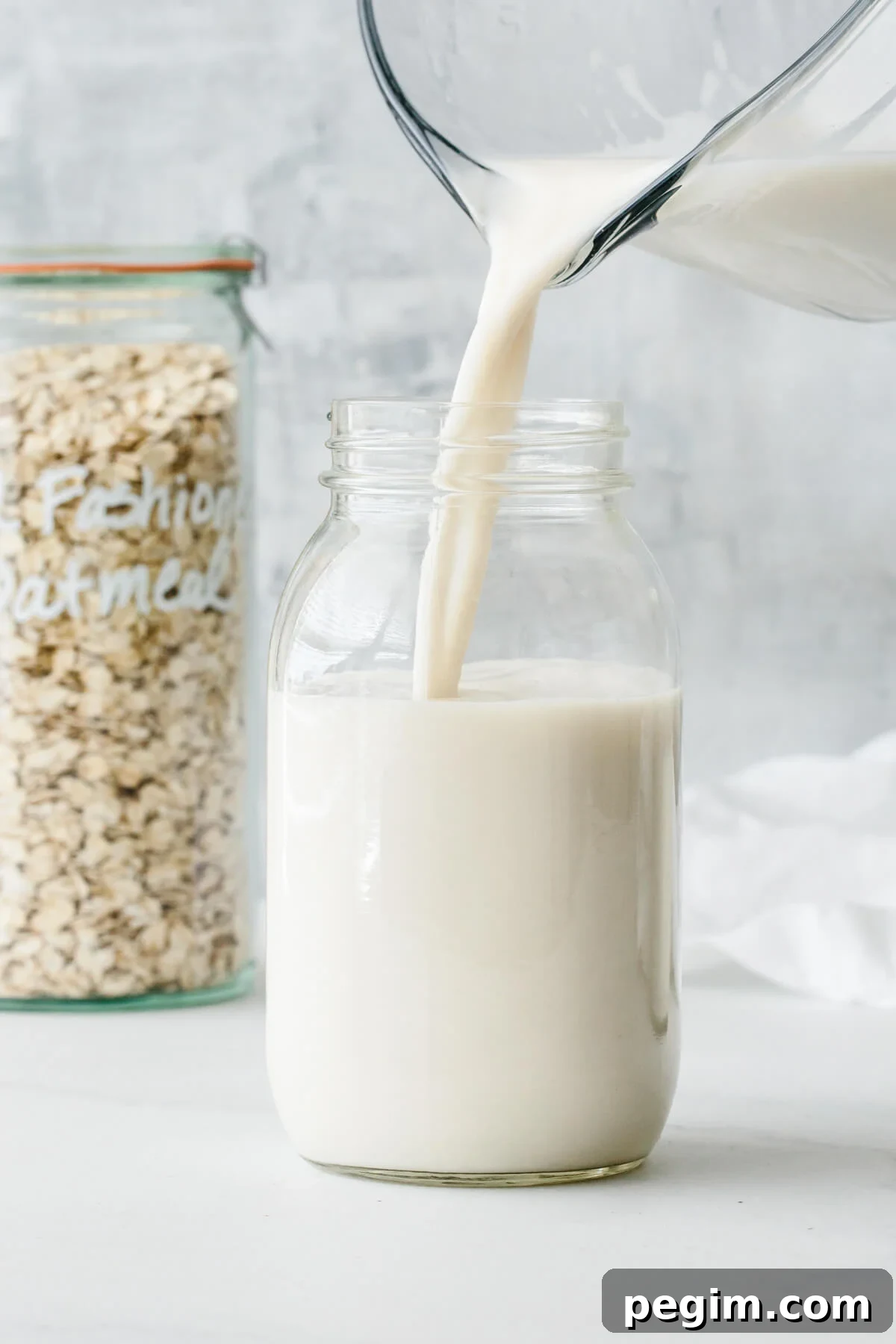 45+ Delicious Vitamix Recipes for Every Meal 5 Oat milk poured into a glass container.