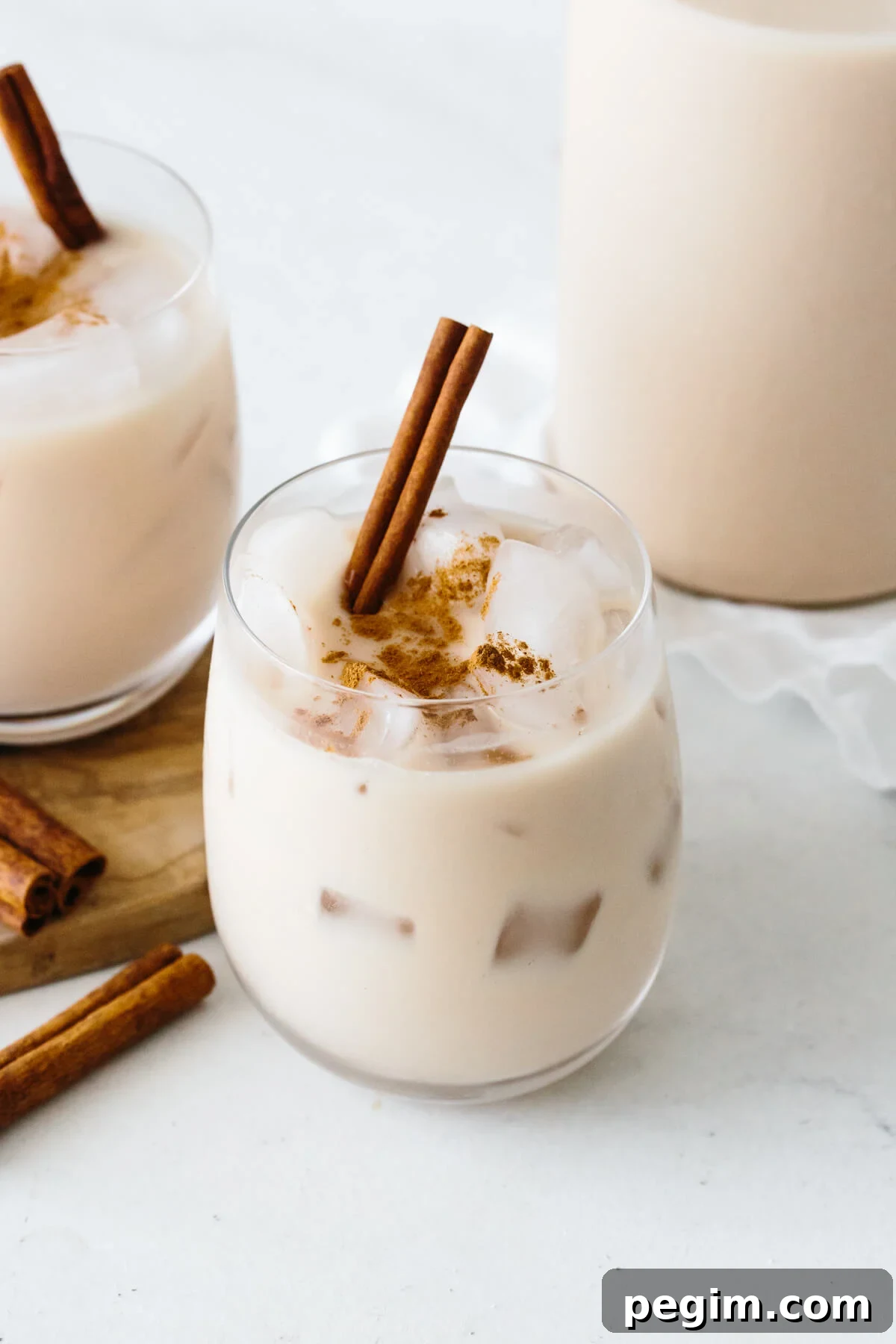 45+ Delicious Vitamix Recipes for Every Meal 7 Horchata in a glass with cinnamon stick.