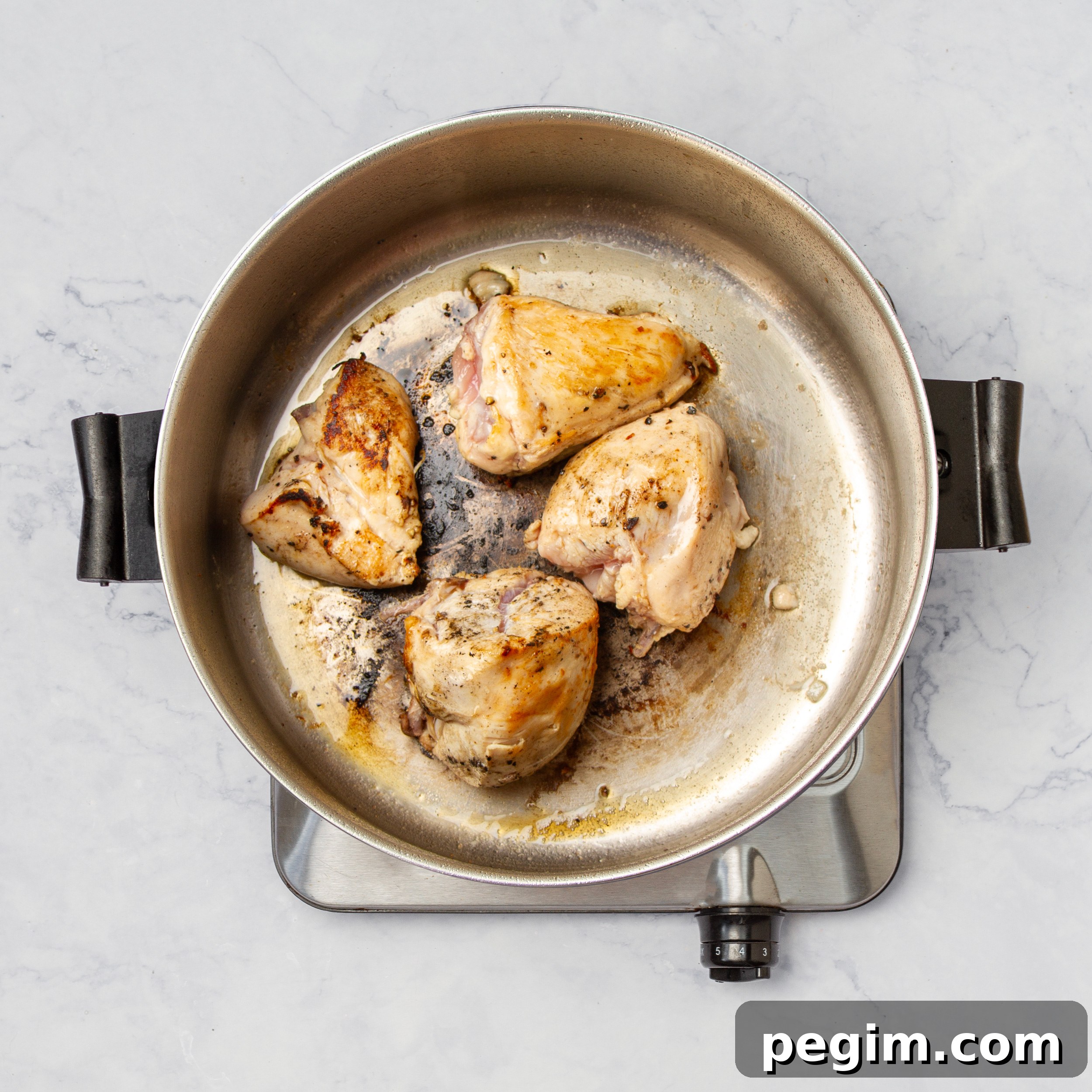 Aguadito de Pollo: Classic Peruvian Chicken Soup Recipe 5 Seasoned chicken cooking in a pan.