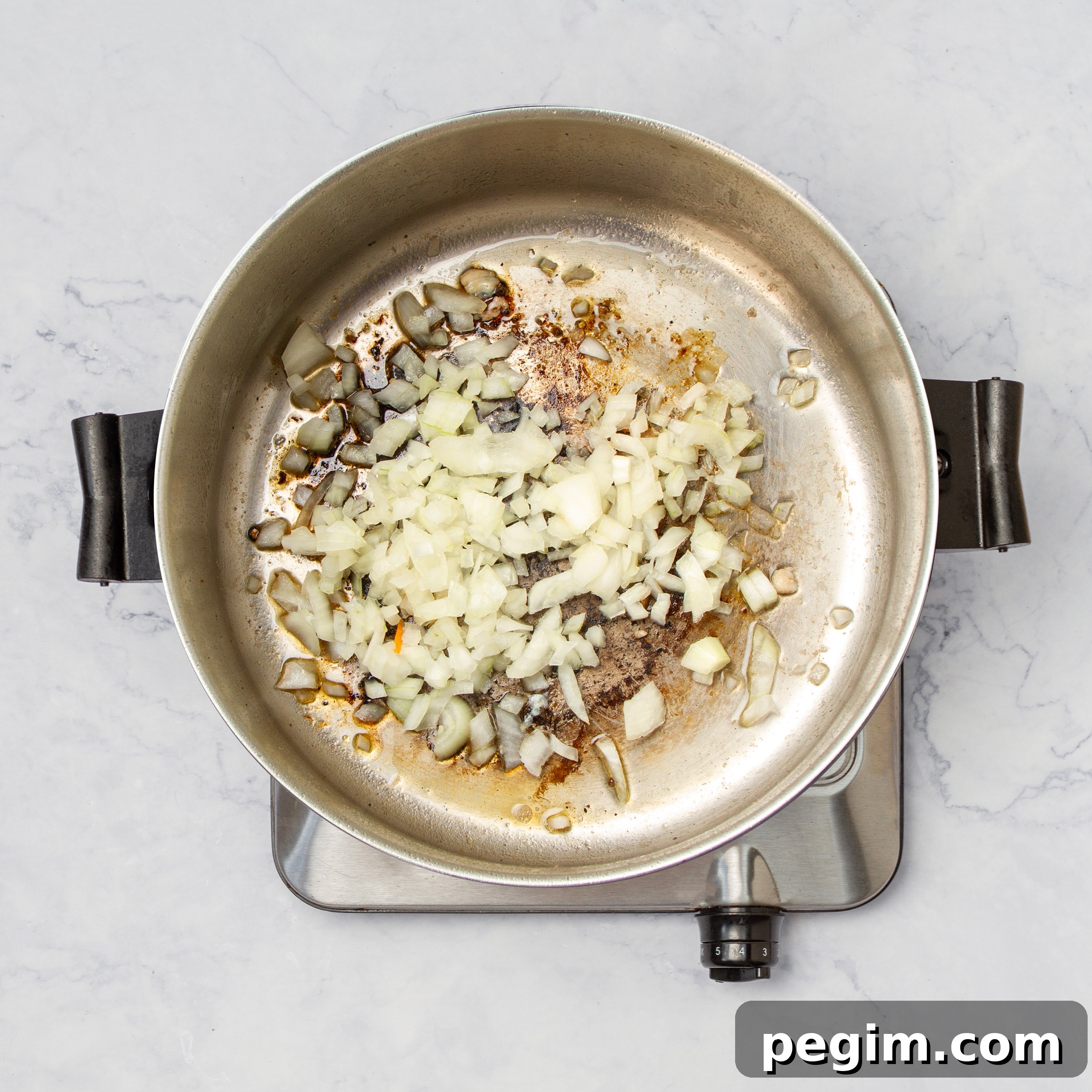 Aguadito de Pollo: Classic Peruvian Chicken Soup Recipe 6 Aromatics cooking in a pan.