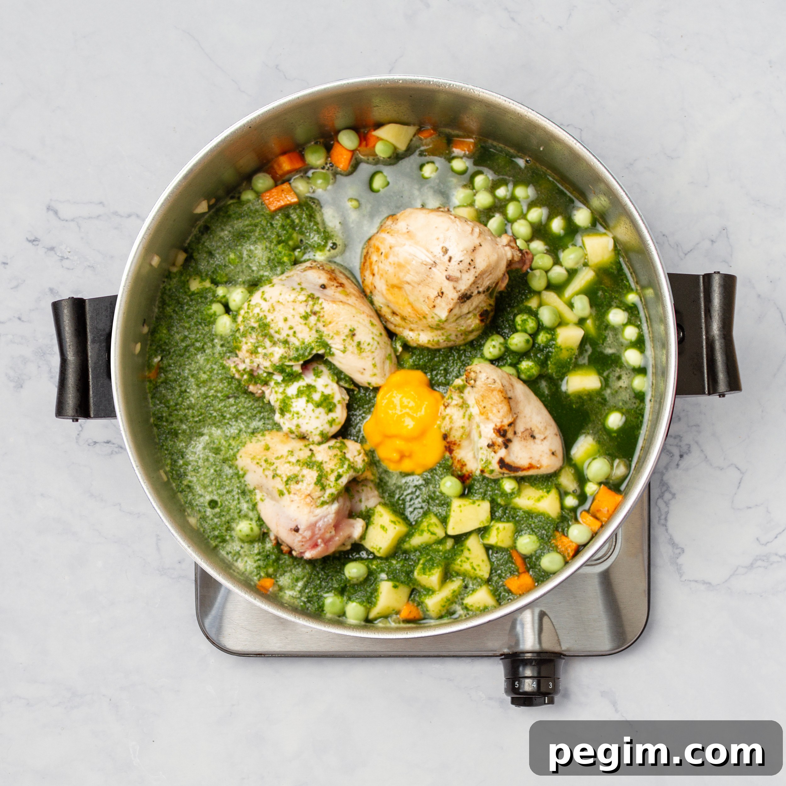 Aguadito de Pollo: Classic Peruvian Chicken Soup Recipe 8 All soup ingredients simmering in a pot.