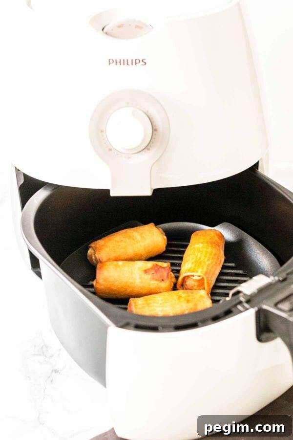 You do not need to deep fry your egg rolls or spring rolls. Get your Air Fryer out and make Air Fryer frozen egg rolls. Dip in some egg wash and fry until hot and crispy. Serve as a snack or appetizer for your Asian-inspired dinner.