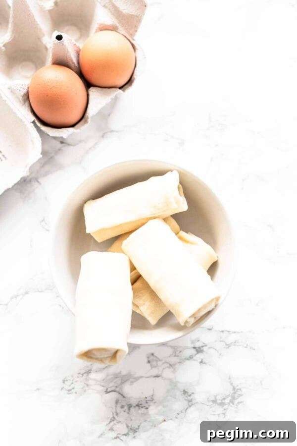 You do not need to deep fry your egg rolls or spring rolls. Get your Air Fryer out and make Air Fryer frozen egg rolls. Dip in some egg wash and fry until hot and crispy. Serve as a snack or appetizer or Asian-inspired dinner.