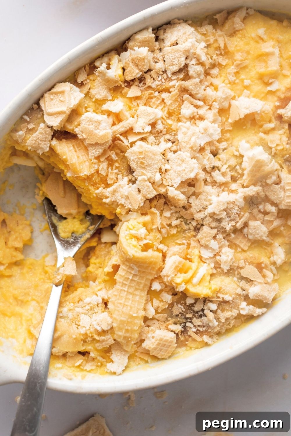 Banana pudding in part of a white casserole dish.