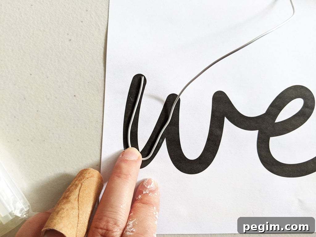 Make Wired Word Signs at Home with Free Template 4 Tracing wire over paper template